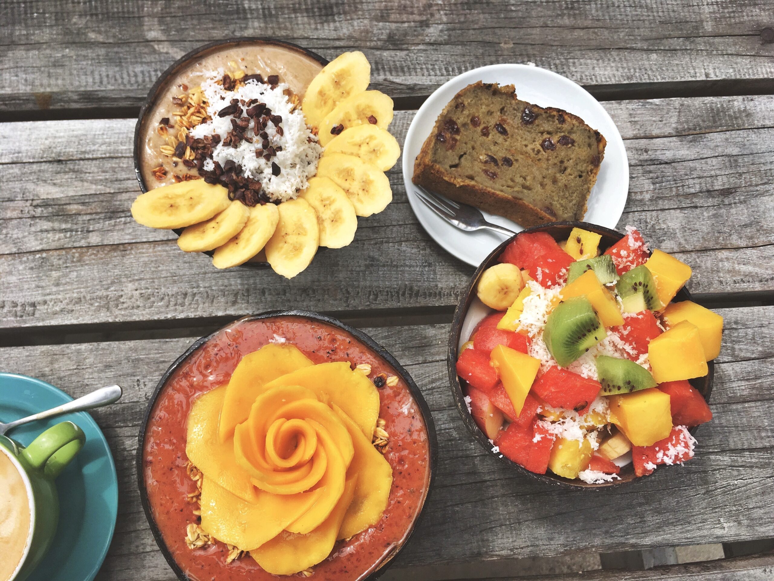 Fruit bowls that show a sweet breakfast.